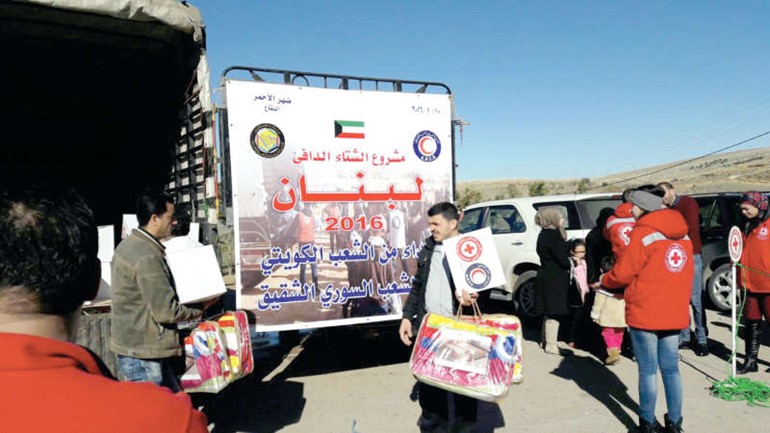 جانب من توزيع المساعدات على الاسر السورية النازحة في لبنان ﻿
