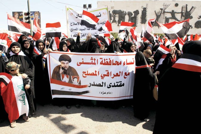 مسيرة نسوية داعمةلمطالب زعيم التيار الصدري مقتدى الصدر ضد الفساد في بغداد امسرويترز﻿