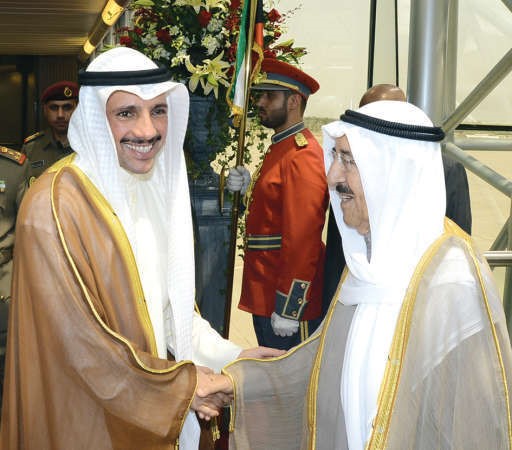 صاحب السمو الامير مصافحا رئيس مجلس الامة مرزوق الغانم لدى مغادرته الى تركيا