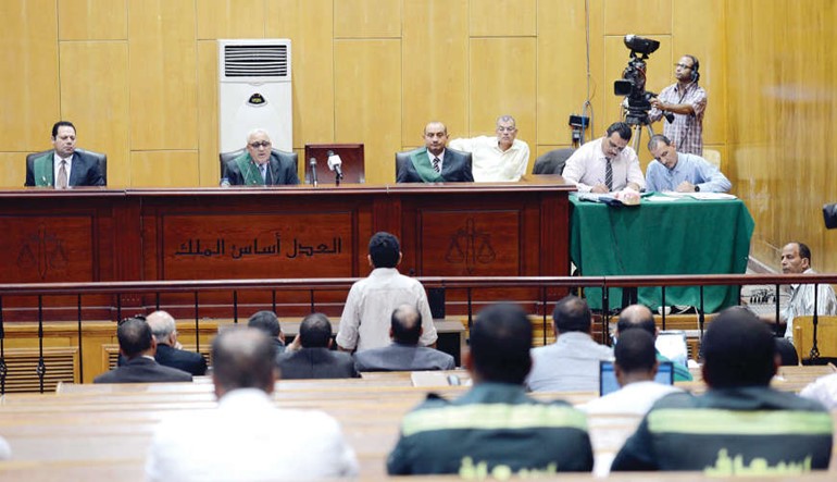 صورة ارشيفية لجانب من محاكمة المتهمين في قضية اقتحام سجن بورسعيد