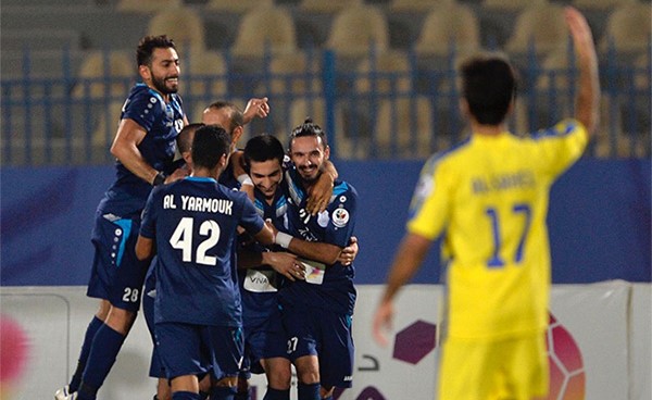 لاعبو اليرموك والفرحة بعد تسجيل يوسف نجف لهدف المباراة الوحيد