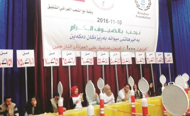 جانب من توزيع القسائم الشرائية﻿