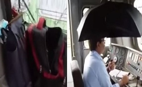 بالفيديو.. سائق قطار يتصدى لمياه مسربة في عربة القيادة بمظلة