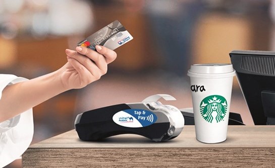 «الوطني» يتعاون مع «ستاربكس» لتوفير خدمة Tap & Pay للعملاء
