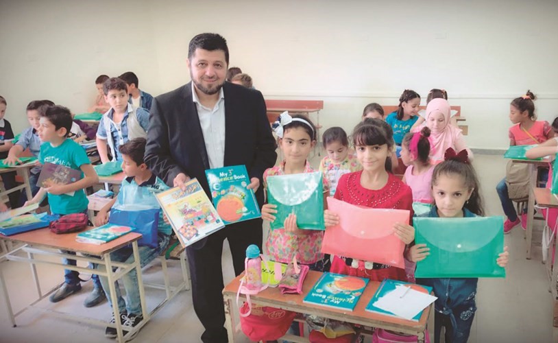 خليل حمادي خلال افتتاح العام الدراسي في مدارس الكويت الخيرية﻿