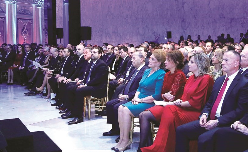 الرئيس العماد ميشال عون واللبنانية الأولى ناديا الشامي عون خلال حفل عيد الميلاد في بعبدا بحضور رئيس مجلس الوزراء سعد الحريري وعدد من الشخصيات - (محمود الطويل)﻿