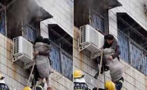 بالفيديو.. مشلول يتسلق مبنى محترق لإنقاذ امرأة حامل