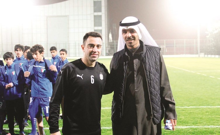 أحمد عجب مع النجم الاسباني تشافي﻿