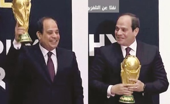 صورة تلفزيونية مركبة للرئيس عبدالفتاح السيسي يرفع كأس العالم﻿