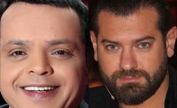 بالفيديو.. عمرو يوسف يتحدى هنيدي بصورة البطاقة الشخصية.. من الأكثر وسامة؟