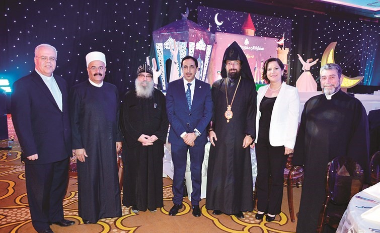 ماهر خير متوسطا القمص بيجول الأنبا بيشوي وعددا من رجال الدين﻿