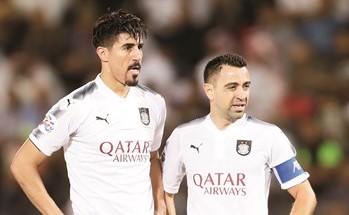 النجم الإسباني تشافي مع بغداد بونجاح ﻿