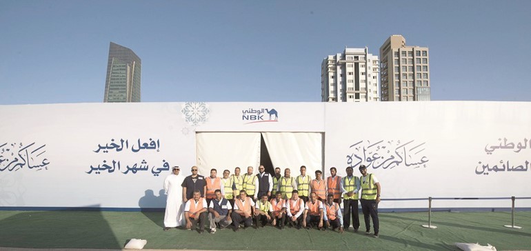 عشرات المتطوعين من موظفي الوطني شاركوا في فعاليات البرنامج﻿