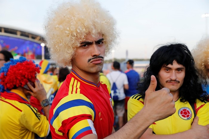 لاعب كولومبيا خوان كوادرادو يسجل الهدف الثالث في مرمى بولندا