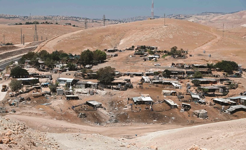 منظر عام لقرية الخان الأحمر شرقي القدس التي حولها الاحتلال لمنطقة عسكرية تمهيدا لهدمها	(أ.ف.پ)﻿