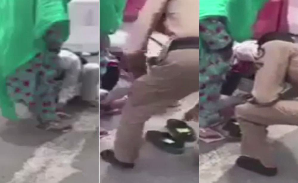 بالفيديو.. رجل شرطة سعودي يقدم حذاءه لحاجة مسنة