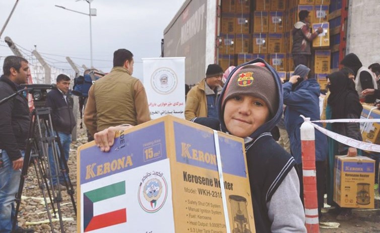 جانب من المساعدات المقدمة من الكويت للنازحين العراقيين بالتنسيق مع مؤسسة البارزاني الخيرية﻿