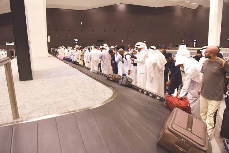 الحجاج في انتظار حقائبهم﻿