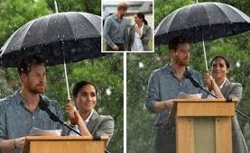 بالفيديو.. ميغان ماركل الحامل تحمل المظلة لزوجها هاري في بلدة أسترالية
