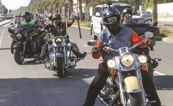إيمان الغربللي في مقدمة عدد من سائقي الدراجات النارية ﻿