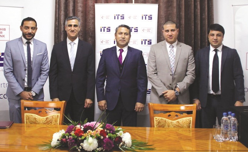 الخشنام وزاردوف عقب توقيع الشراكة بين its والبنك الطاجيكي﻿