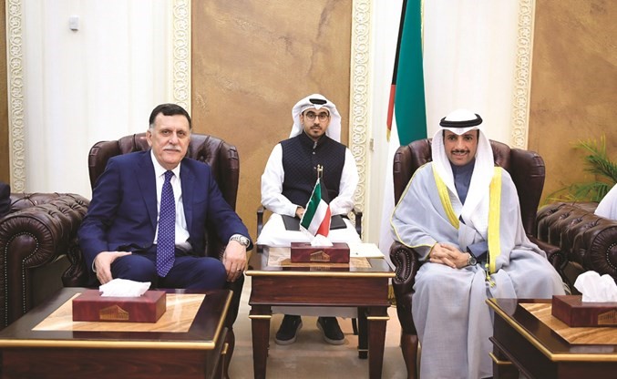 رئيس مجلس الأمة مرزوق الغانم مع رئيس حكومة الوفاق الوطني في ليبيا فائز السراج﻿