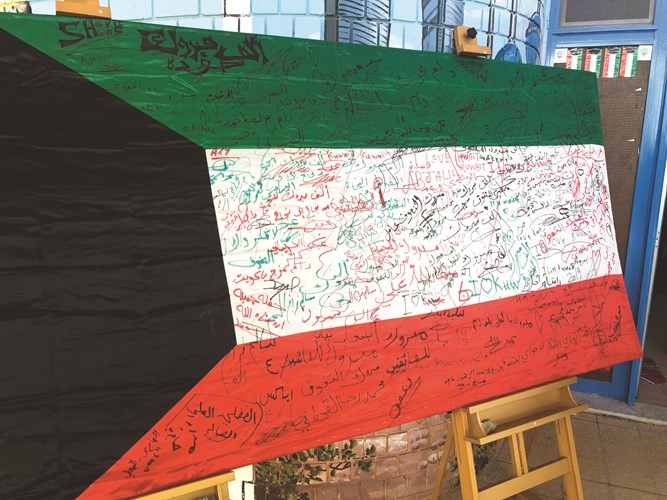 علم الكويت شاهد على بصمات المتفوقين وذويهم وأعضاء هيئة التدريس﻿