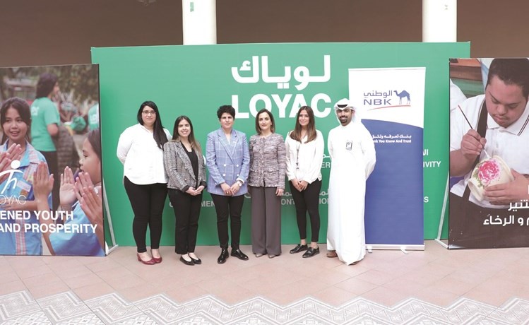منال المطر وفاديا المرزوق تتوسطان فريق عمل الوطني ولوياك﻿