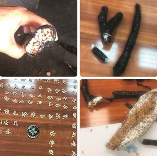 جانب من ١٠٠٠ حبة المضبوطة داخل مخبئها بعد تفريغها﻿