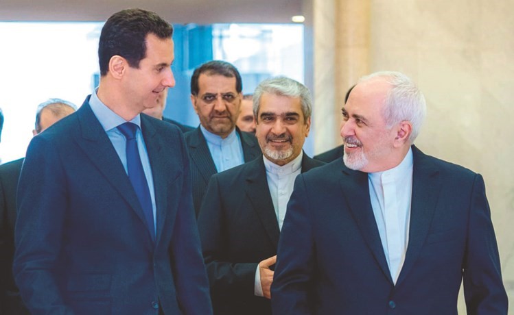 الرئيس بشار الاسدمستقبلا وزير الخارجية الايراني محمد جواد ظريف	 (أ.ف.پ)﻿