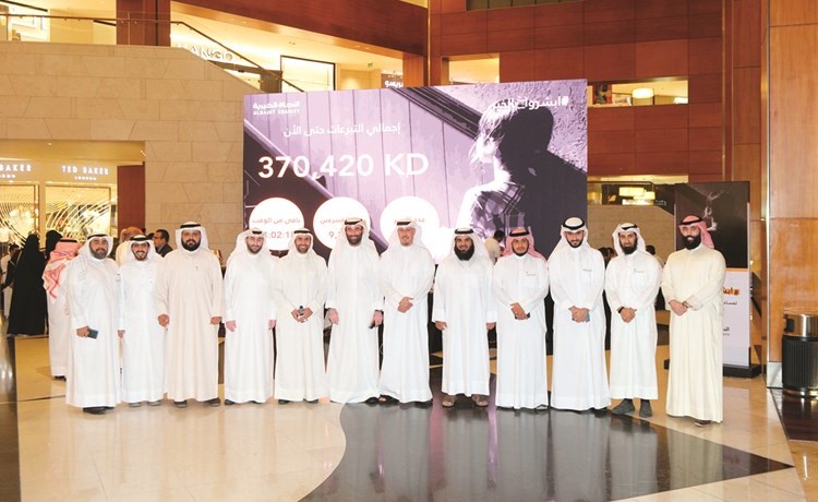 صورة تجمع فريق عمل Ooreedoo وأعضاء جمعية النجاة الخيرية﻿