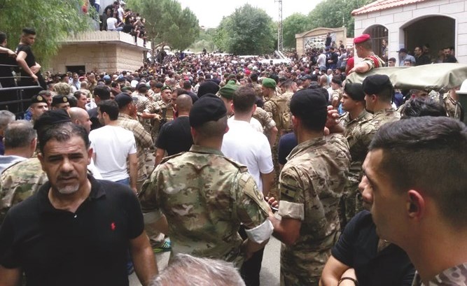 تشييع شهيد الجيش النقيب حسن علي فرحات في بلدته برعشيت في قضاء بنت حبيل- (محمود الطويل)﻿