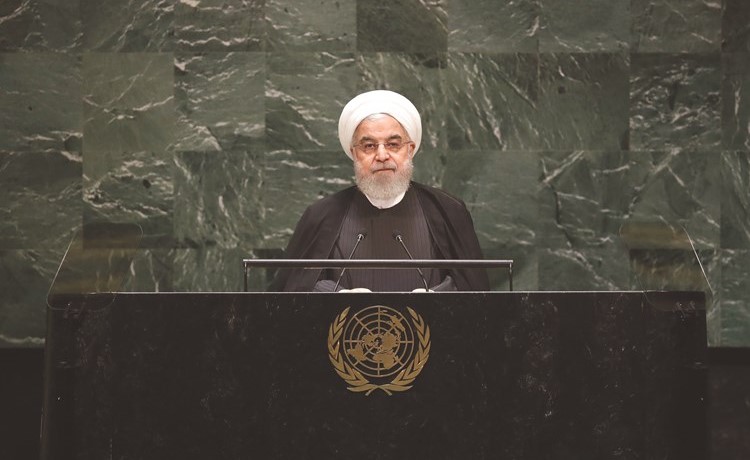الرئيس الإيراني حسن روحاني ملقيا كلمته أمام الجمعية العامة للأمم المتحدة بنيويورك أمس 	(أ.ف.پ)﻿