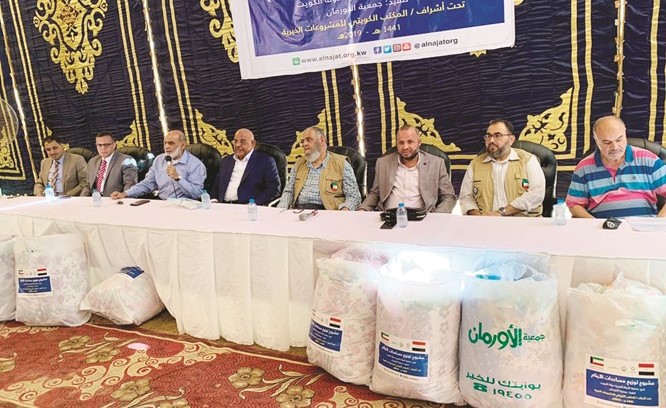 ممثلو الجانبين خلال الاحتفال بتوزيع المساعدات في مصر﻿
