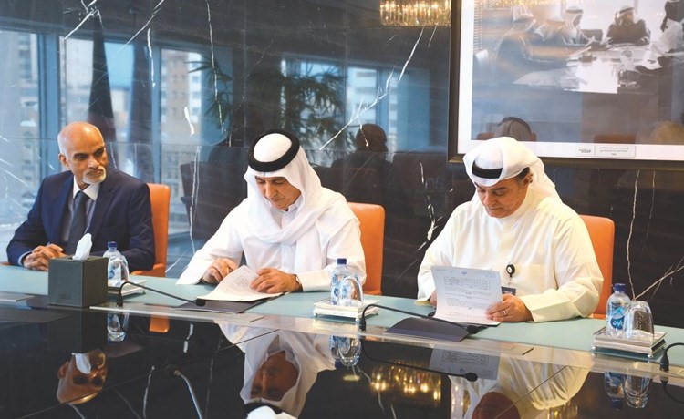 جانب من توقيع بروتوكول التعاون بين بنكي برقان والائتمان ﻿