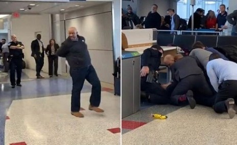 بالفيديو.. مشاجرة عنيفه بين رجل ضخم وضابط شرطة في صالة المطار