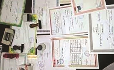 صورة أرشيفية لشهادات وأختام مزورة