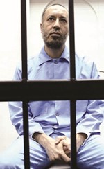 صورة ارشيفية للساعدي القذافي اثناء محاكمته	(أ.ف.پ)