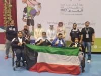 ناصر العجمي وشريفة الغانم ونائب السفير أحمد السلوم يتوسطون أبطال الكويت للمعاقين