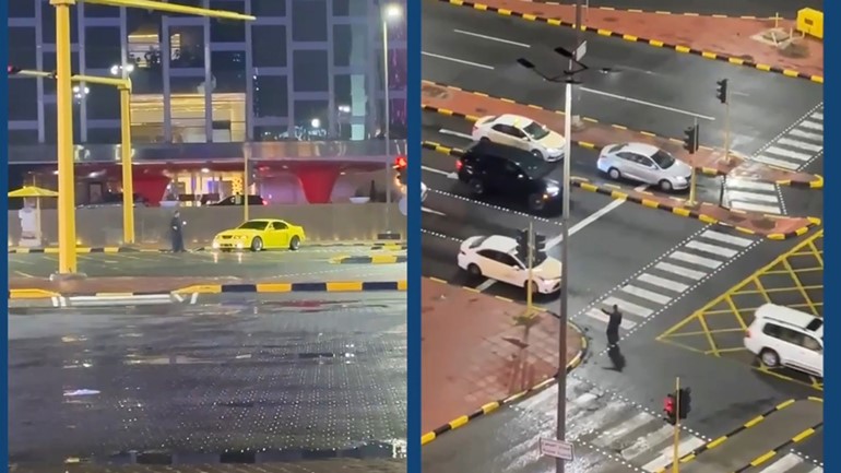 كاميرات المراقبة وثقت قيام الرائد فواز إبراهيم الرويلي بتنظيم حركة السير خلال أمطار الخير